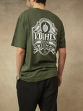 Koohl's Bier T-Shirt, Rückenmotiv Bierlabel, weißer Druck per Siebdruck mit wasserbasierten Farben auf grünem oversized Bio-Baumwolle T-Shirt, Slow Fashion