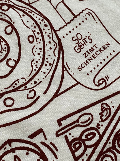 Nachhaltiges Bio-T-Shirt mit Zimtschneckenmotiv, handbedruckt – Koohl’s Slow Fashion